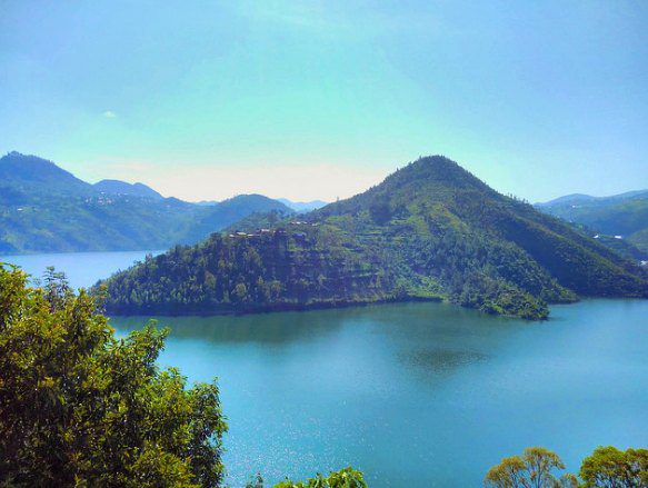 Forested peninsula and terraced green hills rising from the blue water of Lake Kivu, Rwanda