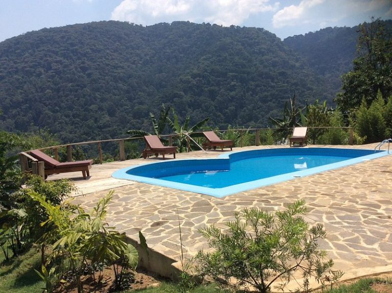 Trackers Safari Lodge Bwindi: Log Chalets and a Pool in Buhoma